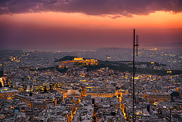 Athens city at sunset with Parthenon and Acropolis seen from Lycabettus hill viewpoint in Greece