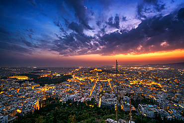 Athens city at sunset with Parthenon and Acropolis seen from Lycabettus hill viewpoint in Greece