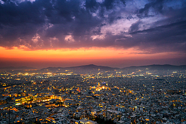 Athens city at sunset with Parthenon and Acropolis seen from Lycabettus hill viewpoint in Greece