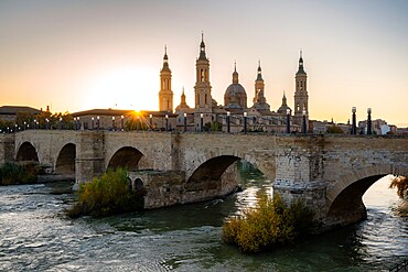 Basilica del Pilar Cathedral with stone bridge crossing Ebro River, Zaragoza, Aragon, Spain, Europe