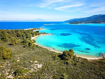 Diaporos island with wild beaches and turquoise water drone aerial view in Greece