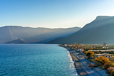 Lakkos beach with turquoise water and mountains in the background, in Greece