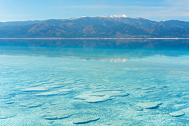 Salda lake with stromatolites in the turquoise water on a sunny day in Turkey