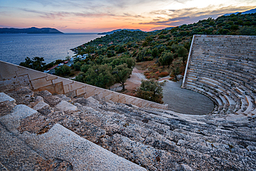 Ancient theater of Antiphellos ancient city at sunset in Kas, Turkey