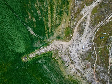 Drone aerial view of camper van in Marmara dry lake now full of vegetation in Turkey at sunset