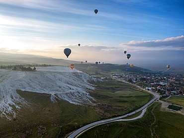 Drone view of hot air balloons at sunrise in Pamukkale, Turkey