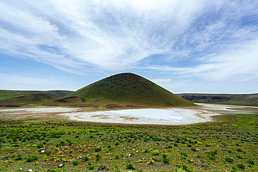 Meke crater dry lake with green vegetation on a sunny day in Turkey