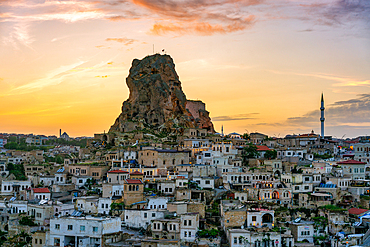 Ortahisar city with castle and mosque in Cappadocia at sunset, Turkey