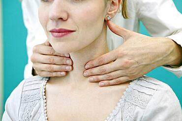 Thyroid palpation, woman