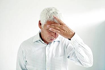 Elderly person with headache