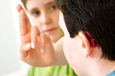 Do not use for HIV. A young boy and his brother using the French sign language to discuss with his hearing-impaired brother