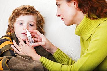 Child using nose spray