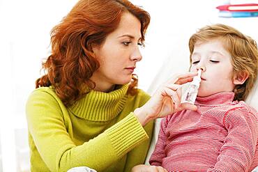 Child using nose spray