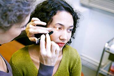 Doctor examining patient's eye.