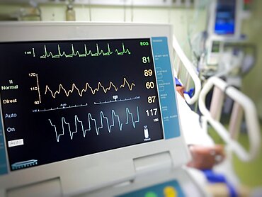 Close up EKG monitor in icu room.