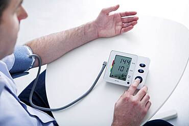 Man measuring his blood pressure.