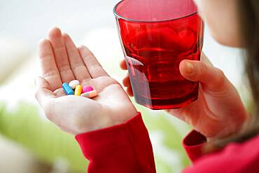 Woman taking medication