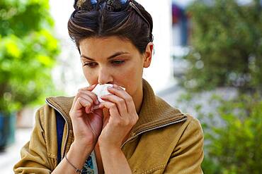 Woman sneezing