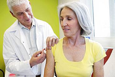 Vaccinating an elderly person