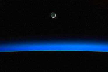 Crescent Moon Over Earth From ISS