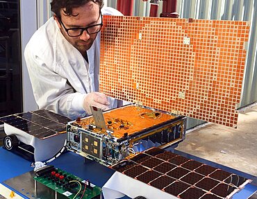 Engineer Tests Solar Array on CubeSat