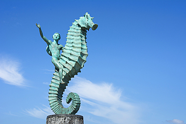 Boy on the Seahorse sculpture by Rafael Zamarripa on the Malecon in Puerto Vallarta, Jalisco, Mexico.