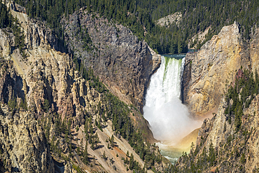 Lower Falls of the Yellowstone River, with rainbow at base of the falls, from Artists Point, Yellowstone National Park, Wyoming.