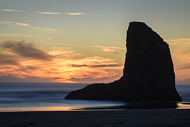 Sea stack on Bandon Beach at sunset, southern Oregon Coast.