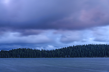 Evening storm clouds over Diamond Lake, Cascade Mountains, Oregon.