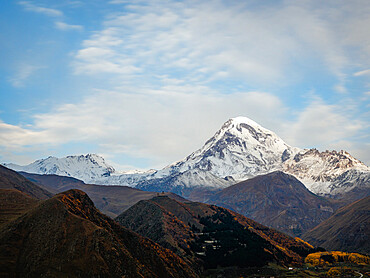 Sunrise view of Gergeti Trinity Church and Mount Kazbek, Kazbegi, Georgia (Sakartvelo), Central Asia, Asia