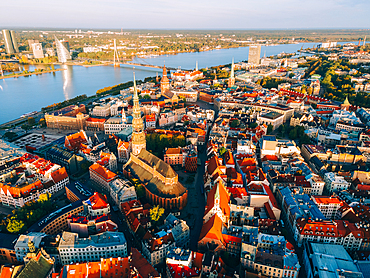 Aerial drone sunrise view of St. Peter's Church in Riga Old Town (Vecriga), UNESCO World Heritage Site, Riga, Latvia, Europe