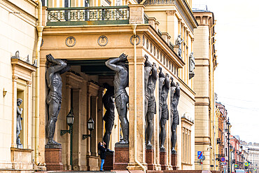 Atlantes, granite giants by sculptor Alexander Terebenev supporting the portico of the New Hermitage, St. Petersburg, Russia, Europe