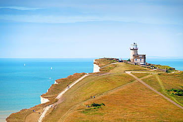 The white cliffs of Beachy Head and Belle Tout (Belle Toute) Lighthouse, South Downs National Park, East Sussex, England