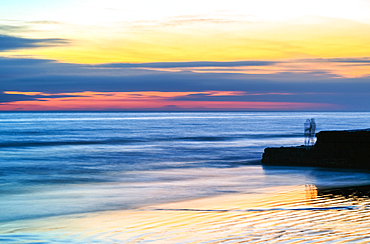 Colourful sunset over the English Channel as seen from the Brighton beach, City of Brighton and Hove, East Sussex, England