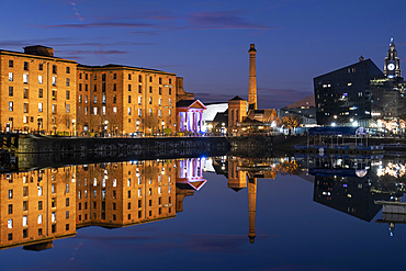 The Albert Dock and Pumphouse reflected in Salthouse Dock at night, Liverpool Waterfront, Liverpool, Merseyside, England, United Kingdom, Europe