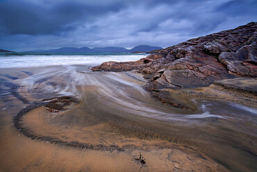 Swirling Wave Patterns at Luskentyre Beach backed by the Harris Hills, Isle of Harris, Outer Hebrides, Scotland, United Kingdom, Europe