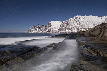 Night sky over The Devils Jaw (The Devils Teeth) (Okshornan) mountains, Tungeneset, Senja, Troms og Finnmark county, Norway, Scandinavia, Europe