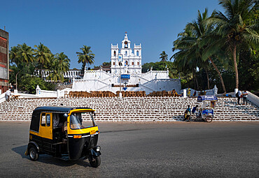 Tuk Tuk passing The Church of Our Lady of the Immaculate Conception, UNESCO World Heritage Site, Panjim City (Panaji), Goa, India, Asia