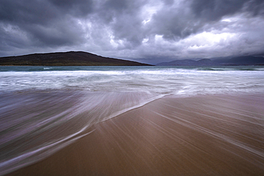 Stormy skies over the Island of Taransay from Luskentyre Beach, Isle of Harris, Outer Hebrides, Scotland, United Kingdom, Europe