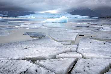 Ice Blocks at Fjallsárlón Iceberg Lagoon backed by the Fjallsjökull Glacier, Vatnajökull National Park, Southern Iceland, Europe