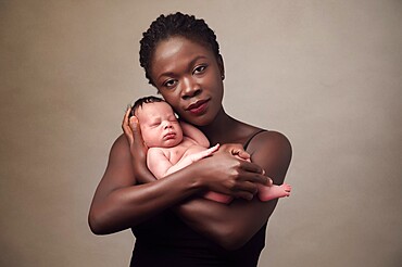 Mother with a baby, studio shot, United Kingdom, Europe