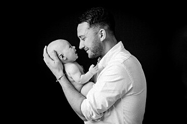 Father with a baby, studio shot, United Kingdom, Europe