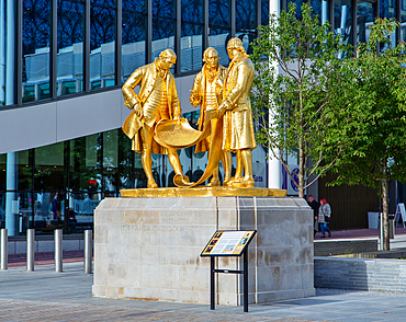 The statue of Matthew Boulton, James Watt and William Murdoch known as The Golden Boys, Centenary Square, Birmingham, West Midlands, England, United Kingdom, Europe