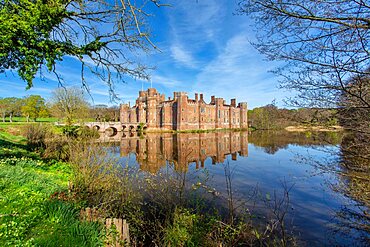 The moat of the brick built 15th century Herstmonceux Castle, East Sussex