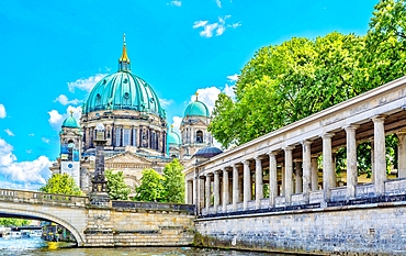 Berlin Cathedral (Berliner Dom) seen from the River Spree. Completed in the Baroque style in 1905, it is a Protestant church. It was badly damaged in World War 2 and repaired between 1975 and 1993.