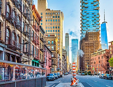 Steam emitted from the New York Steam System. Dating back to 1882 the system provides steam to heat, cool or disinfect some 1,700 buildings. Excess steam is vented from orange and white funnels known as stacks.