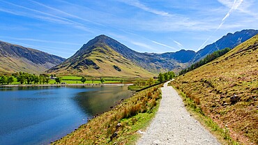 Buttermere with Fleetwith Pike behind, seen from the popular footpath around the lake. The Lake District, Cumbria, England, UK