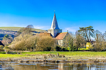 St. Andrew's Church, Alfriston, seen across the River Cuckmere, East Sussex, England, United Kingdom, Europe