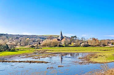 St. Andrew's Church, Alfriston, seen across the River Cuckmere, East Sussex, England, United Kingdom, Europe