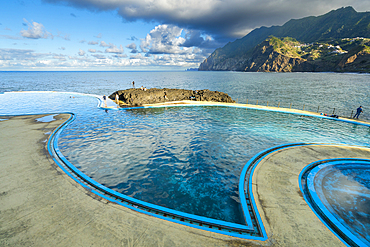 Coastal swimming pools near mountains at Porto da Cruz, Machico District, Madeira, Portugal, Atlantic, Europe